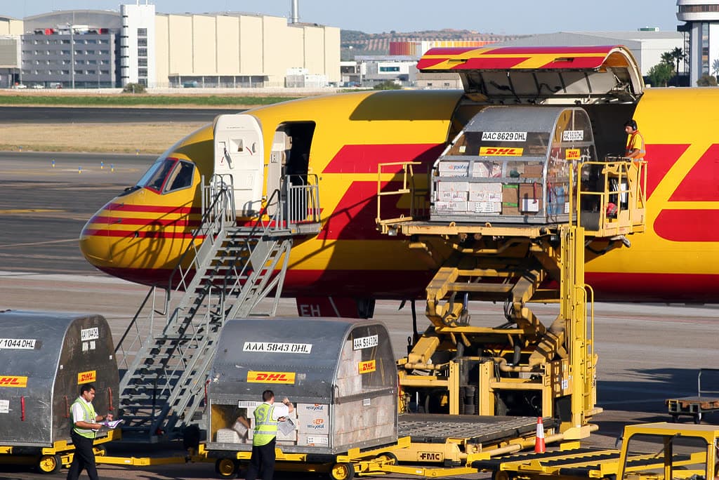 Cargo aircraft being loaded at an airport apron